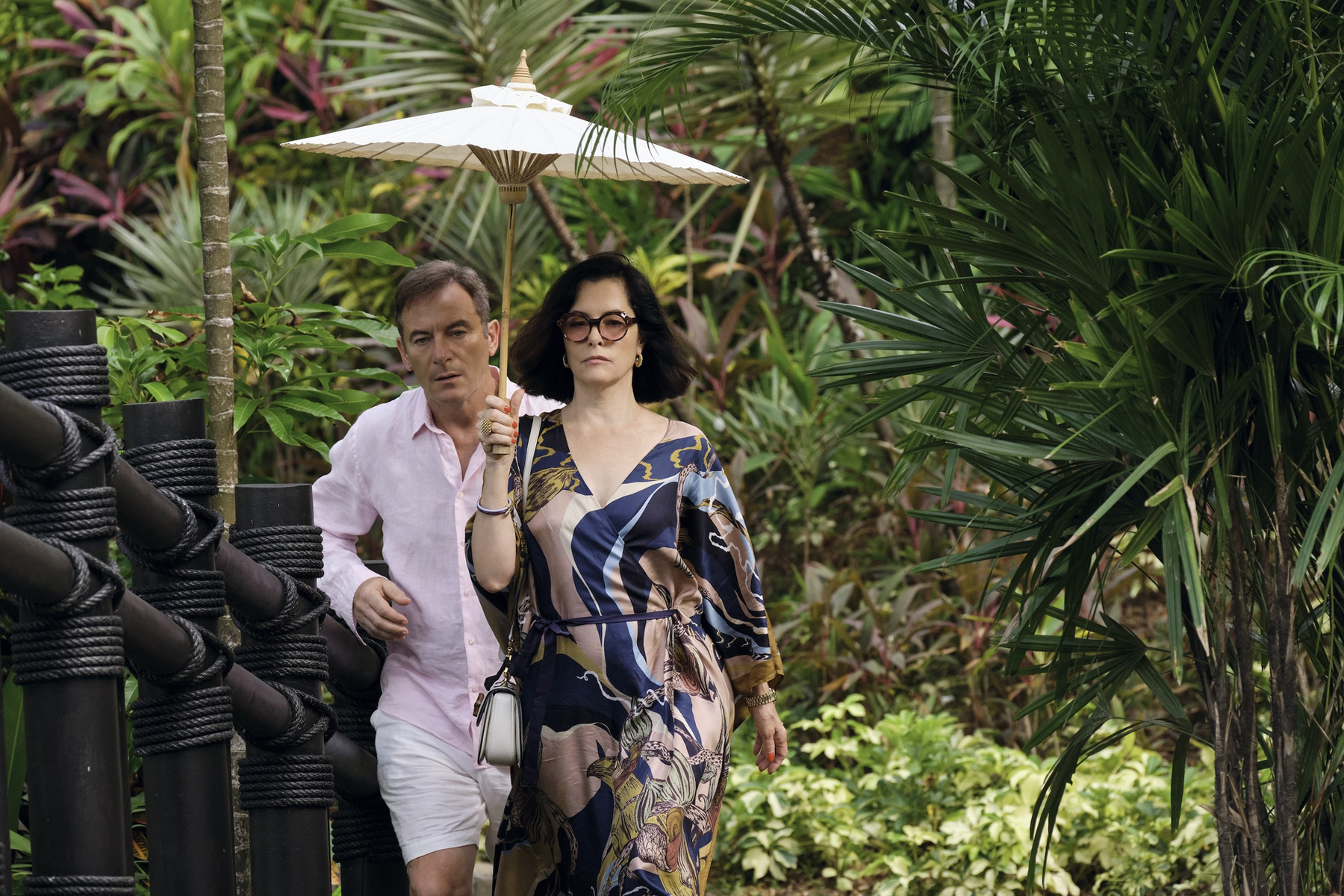 Jason Isaacs and Parker Posey | Courtesy of HBO